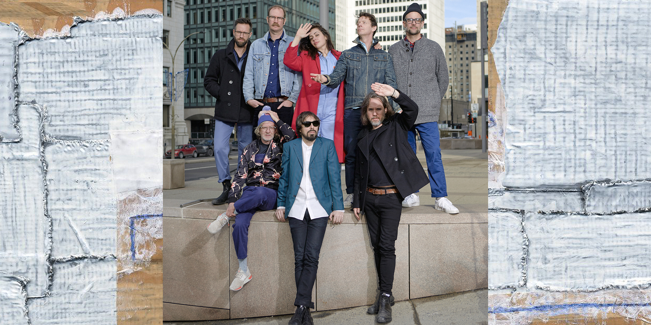 Photograph of members of Broken Social Scene grouped together, gazing into the early afternoon sun